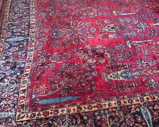 Persian Sarouk rug. Burgundy field. Border is Indigo Blue. Measures 10.3 x 19.4. Circa 1930's.