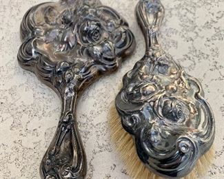Sterling silver brush and mirror set.
