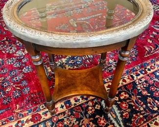 Wood side table with silver frame top.