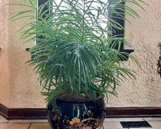 Faux plant in hand-painted chinoiserie pot.