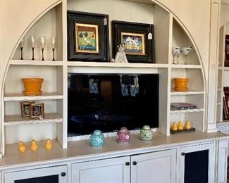 Champagne flutes, martini glasses, ceramic pots, framed art, coffee table books, candles and Chinese ginger jars.