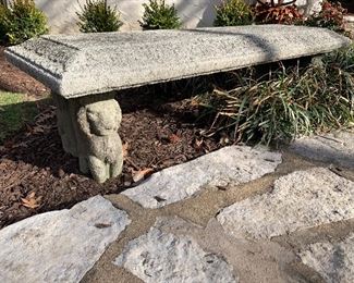 Concrete bench with lion legs.