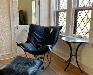 Howard Elliot scroll chair with ottoman. Contemporary metal side table.