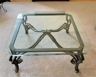 Glass topped coffee table. Measures 39.5” x 39.5” x 17”.