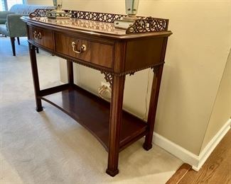Two drawer mahogany console table with gallery top