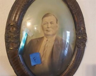 Oval framed antique photograph with original glass