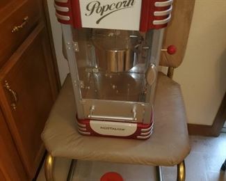 Popcorn machine in like new condition (one of the chairs matching the table)