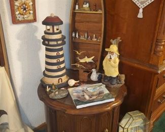 Round accent table (part of matching set 4 of 4), lighthouse, boat shelf, & various other maritime décor 