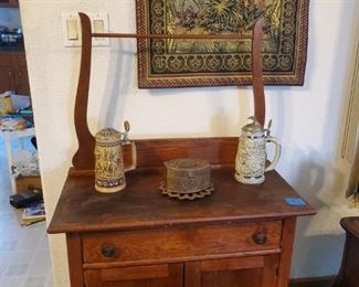 Antique oak washstand, collectible steins, wall tapestry, & more.