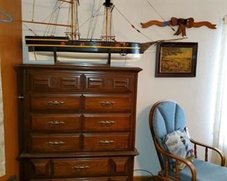 Chest of drawers, one of the large model ships, rocker/glider with ottoman, and more.