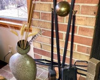 An amazing fireplace tool set and andirons by Donald Deskey!