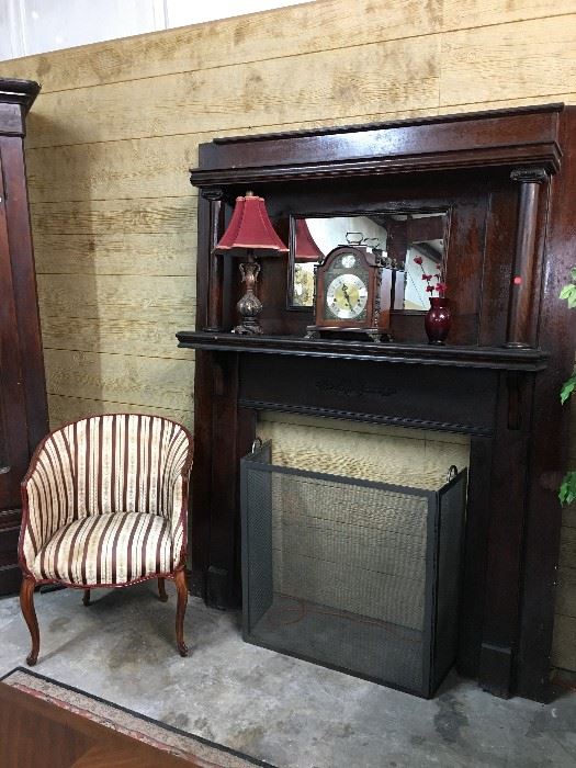 Antique fireplace mantle, Striped accent Chair, Mantle clock 