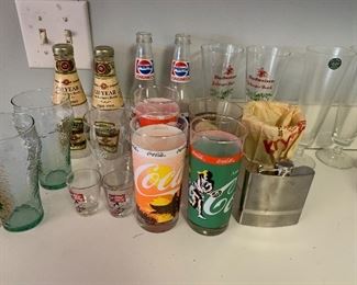 Assorted drink ware and bottles