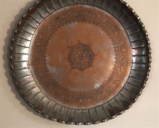 One of several Persian/Middle Eastern copper trays (this one is 22” across - we have bigger & smaller trays)