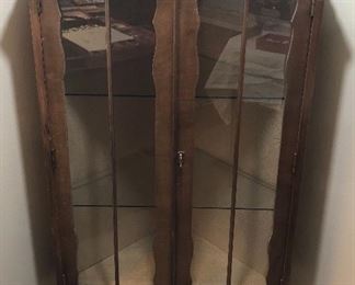 Vintage walnut corner curio cabinet with glass shelves & key (47” tall)
