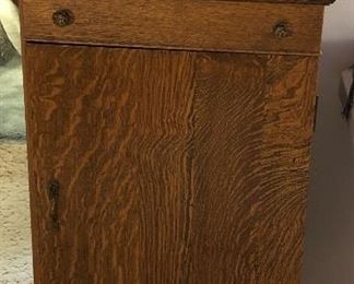 Antique tiger oak sheet music cabinet with mirrored backsplash (20”L, 15”D, 45”H)