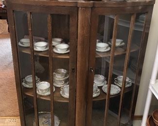 Antique oak display cabinet with curved doors (37”L, 47”H, 15”D at center)