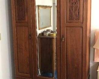 Pretty antique walnut rmoire - center mirror is fixed & doors on either side open.  (52.5”L, 19.5”D, 90”H) Comes apart into 3 pieces for transport!