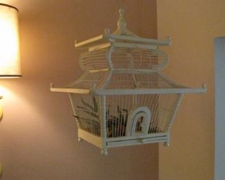 One of two vintage wood bird cages.