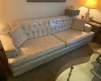 Great couch preserved in plastic!