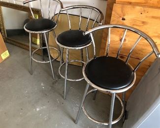 3 stainless upholstered bar height stools. 