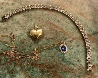 14kg tennis bracelet with diamonds.  14kg puffed heart pendant.  14 kg sapphire and diamond oval pendant and chain.