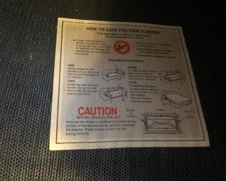 That says, "Caution, this sleeper sofa is not to be used for hiding murder victims like in that old movie with Margot Kidder"