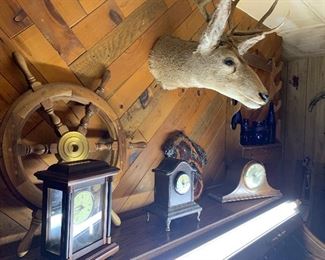 Lots of clocks - please note: the family decided to keep the deer head.