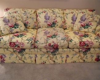 Living Room:  The cheery CENTURY sofa  measures 85" long and has three attached back cushions, three detached seat cushions, and two matching toss pillows.