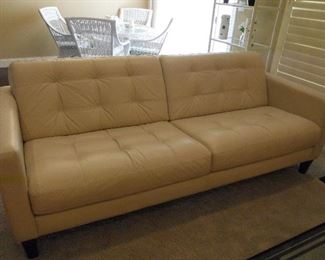 Living Room:  The 7' leather sofa has attached back and seat cushions.  It was recently purchased at Macy's.