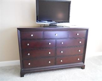 Master Bedroom-Main Floor:   A 9-drawer dresser also from the BRYANT PARK collection from Macy's measures 60" wide x 19" deep x 41" tall.  The 31" SHARP TV comes with a remote and original manual.
