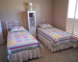 Bedroom #1-Main Floor:  Two twin, white metal headboards/bed frames are priced individually.  The two PERFECT SLEEPER twin mattress sets are also separately priced and are like new!  The tall glass door/2-drawer cabinet measures 18" wide x 12" deep x 63" tall.  The lamp, accessories in the cabinet, and bed linens are all priced as well.