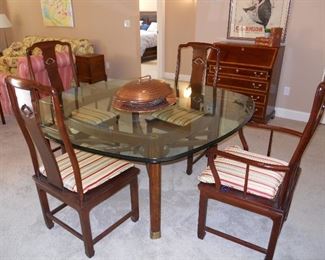 Living Room/Dining Area:  A handsome HENREDON table has a beveled glass top with a wooden base that has brass embellishments.  There is a total of six HENREDON chairs (two arm and four side) that are priced separately from the table. Closer photos follow.  