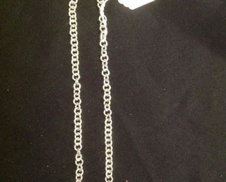 "Smalls" Area-In a Case:  A reproduction sterling .925 TIFFANY tag necklace was purchased in Cozumel, Mexico.