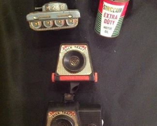 "Smalls Area"-In a Case:  A vintage "Trade Mark Hidden Toy"  M-25 vintage friction toy tank;  a vintage Sinclair Extra Duty Motor Oil bank; a pair of Dick Tracy Wrist Radios.