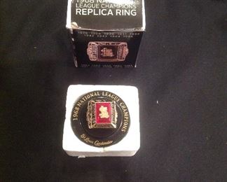 "Smalls Area"-In a Case:  A very collectible 1968 National League Champions St. Louis Cardinals Replica Ring with original box; and a vintage 1950's Stan Musial Pin (as is---missing back pin).