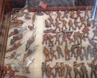 Case:  This case contains numerous vintage World War I & 2 lead soldiers.  The two rows of artillery soldiers on the left are individually priced; the others are priced  at $X per item.  