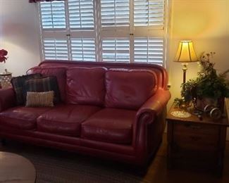 Red leather sofa and side tables