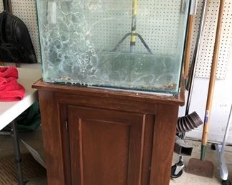 Fish tank and stand (an entire bin full of supplies come with!)