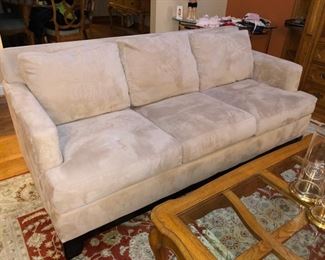 Neutral colored upholstered couch in perfect condition!