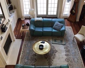 Family Room features 2 leather sofa's 90 x 38 inches
Sofa backs flip up for reading and the ottomon has'a mechanism to lift legs to recline.  $400 each
Matching blankets @ $20.00  There is a rectangle brass table which sits in the middle of the floor.  
Kerman Persian Rug 11x16 - 
Stiffel Reading Floor Lamp
Grandfather French and Italian Antique Clock over 150 years old runs and keeps great time.  Inlaid Wood
2 Vintage Chairs recovered (one not shown)