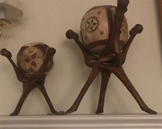Hand carvings - antique 
From West Monrovia Liberia,
West Africa ... President Tubman was president when these were purchased from a tribe member .  

•••look closely•••
As they are carved very intricately.  One piece of wood
Entwined - NO GLUE like things made today...  Balls are
Leather.   Has a type of fur from an animal and be assured they ate the meat after the animal was killed.  