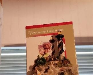 Musical lighthouse picture holder