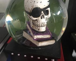 Everyone must have one of these, a musical skull snow globe that sings, "Ding dong the witch is dead"