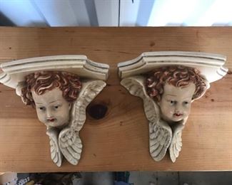 pair of cherub wall shelves