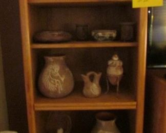 Bookcase andd many pots