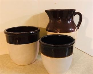 Vintage brown and white stoneware crocks and pitcher. 