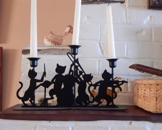 Cats in metal... candle sticks.