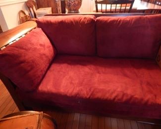 Large wooden frame sofa with burgundy micro fiber fabric.