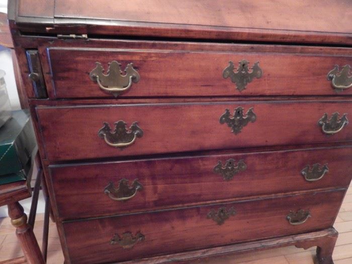 Antique chest of drawers with slant top desk.